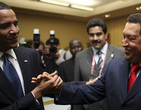 Barack Obama shakes hands with Hugo Chavez