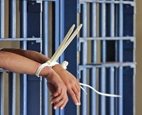 Convict-behind-bars